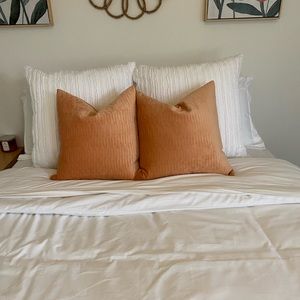 2 salmon colored throw pillows